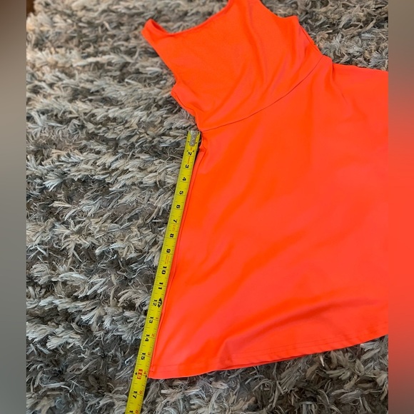 Bright orange mini dress with flared skirt and backless design - Picture 7 of 9